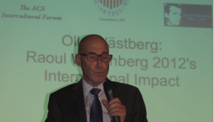 Olle Wästberg speaking on stage